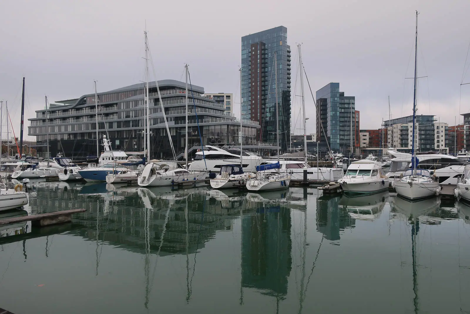 Yachts moored at Ocean Village marina in Southampton with waterfront apartments behind